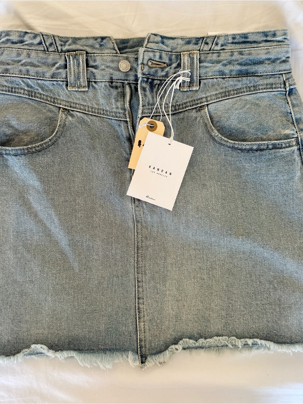 KanCan Light Wash Denim Mini Skirt with Frayed Hem